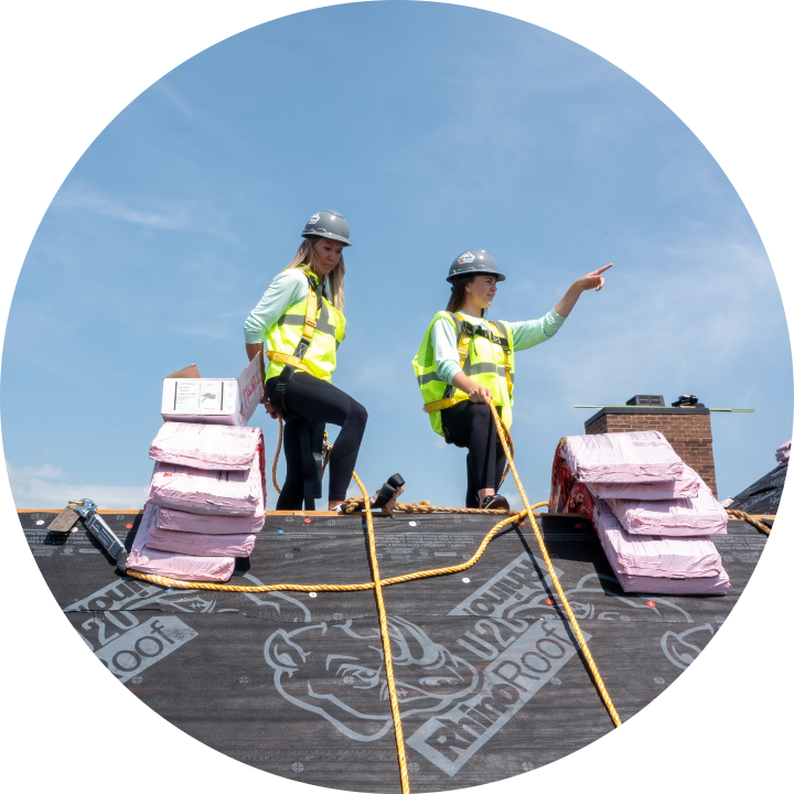 Two Women Roofers on a roof